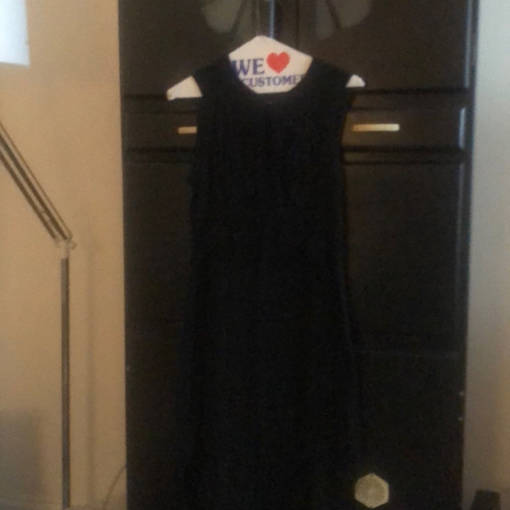 Black sleeveless dress.